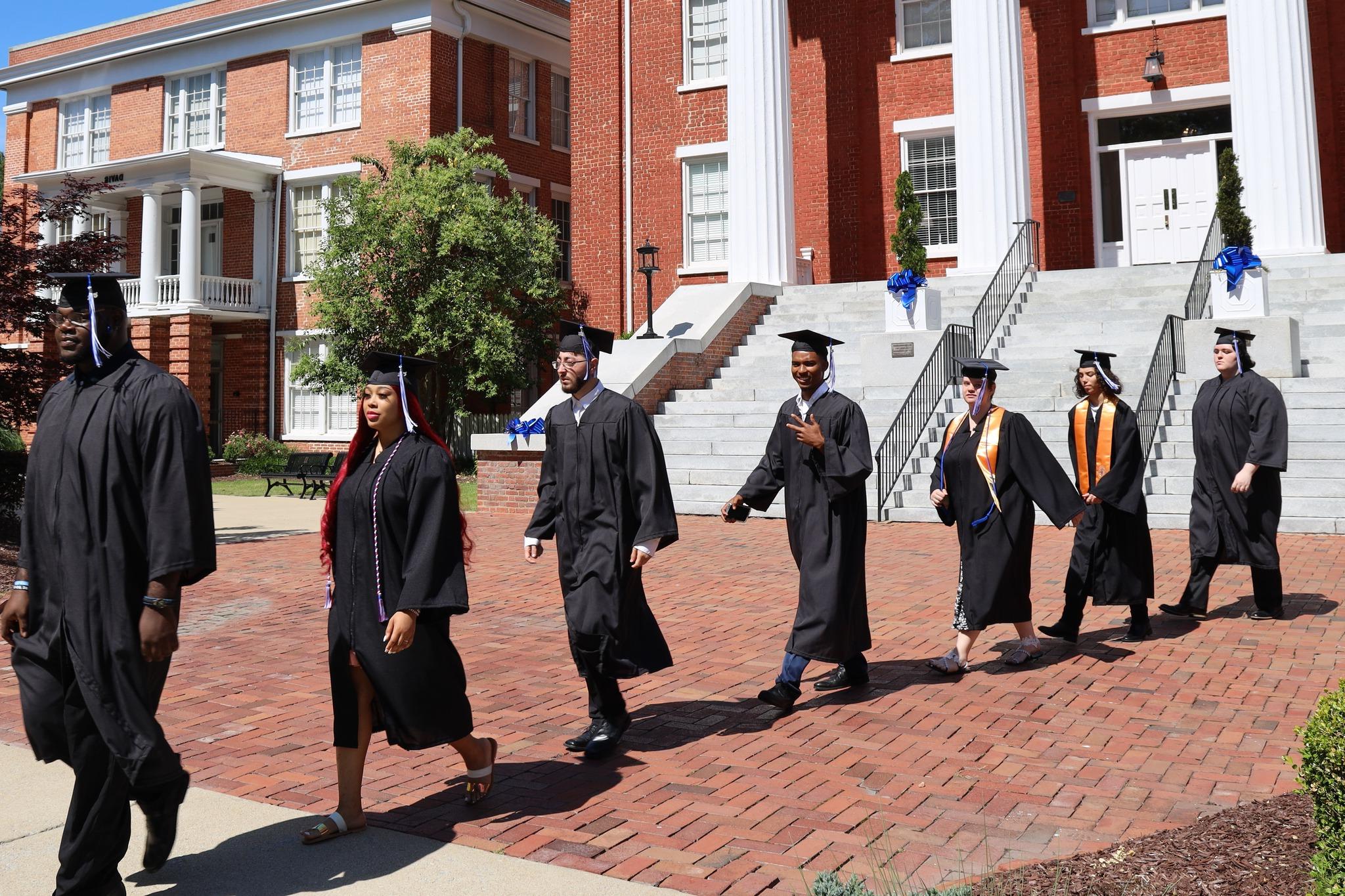 Louisburg College students walking from Main to Commencement Ceremony.